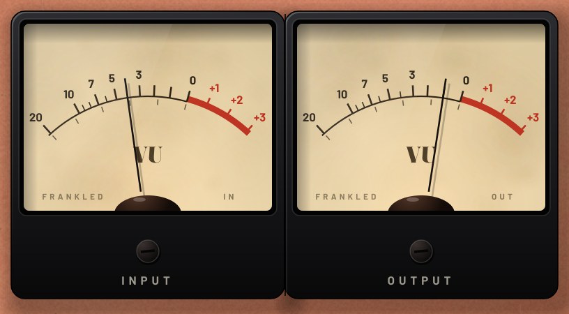 Two cream VU meters side by side in black bakelite cases, labelled Input and Output.